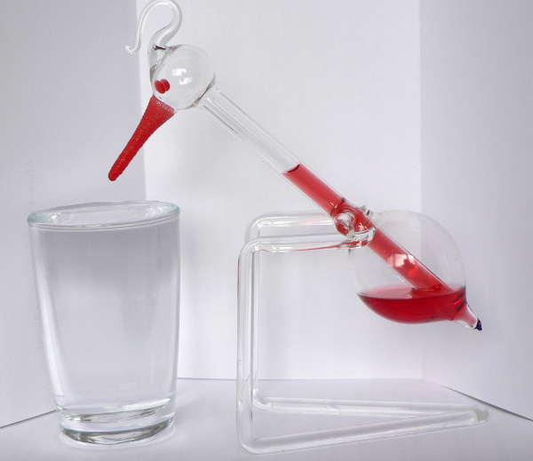 A drinking bird toy.