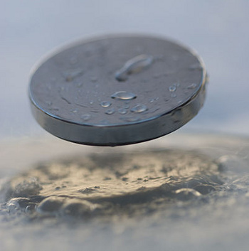 Levitation of a magnet above a YBCO superconductor
