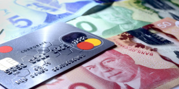 Credit card and Canadian currency.