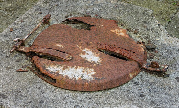 Rusted lid of a rain cistern